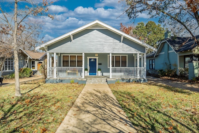 bungalow-style house with a front yard