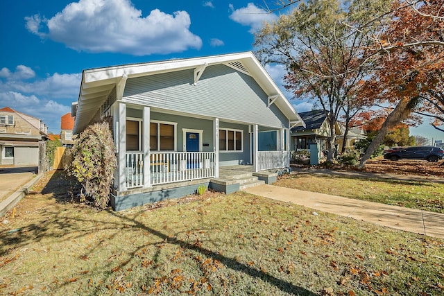 view of front of house featuring a porch and a front yard