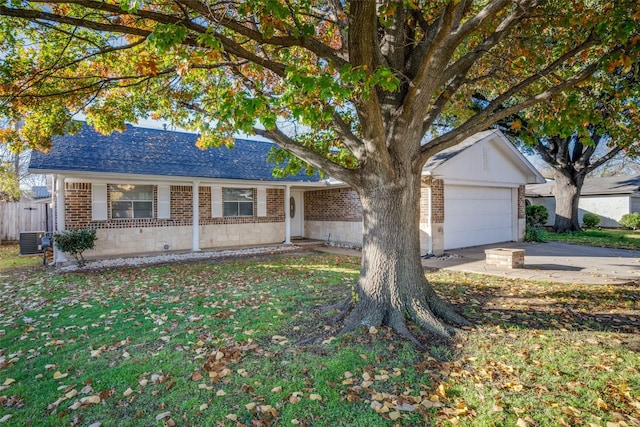 single story home featuring a garage, central air condition unit, and a front lawn