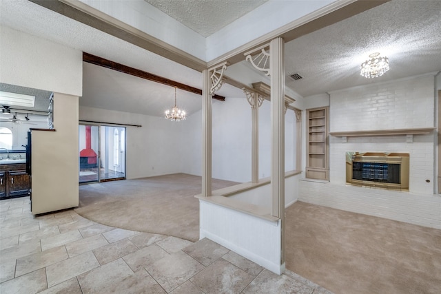 unfurnished living room featuring beam ceiling, a fireplace, light colored carpet, and a textured ceiling