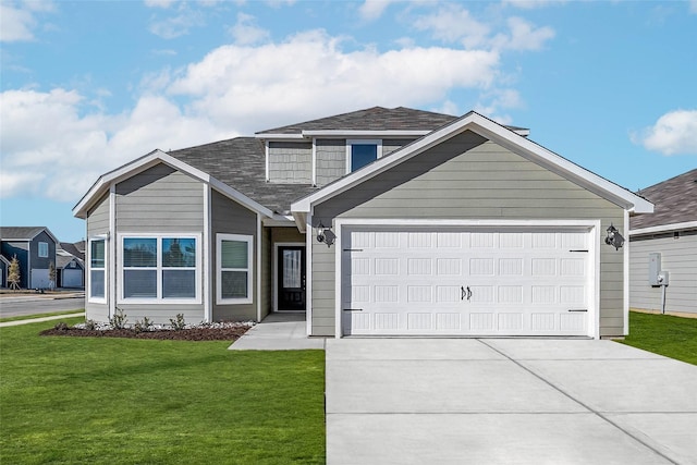 view of front facade featuring a garage and a front lawn