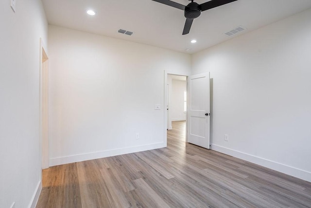 spare room with ceiling fan and light hardwood / wood-style floors