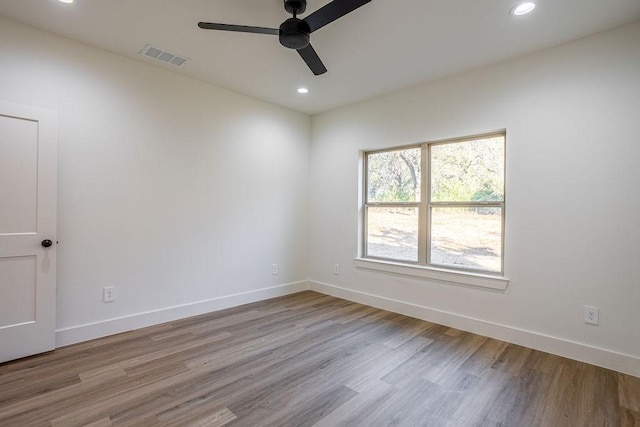 unfurnished room featuring light hardwood / wood-style floors and ceiling fan