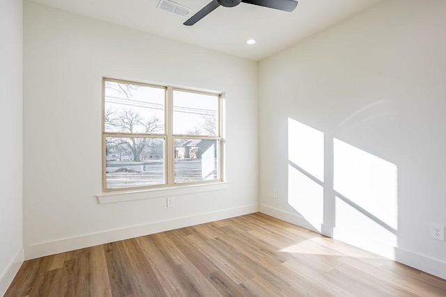 spare room featuring ceiling fan and light wood-type flooring