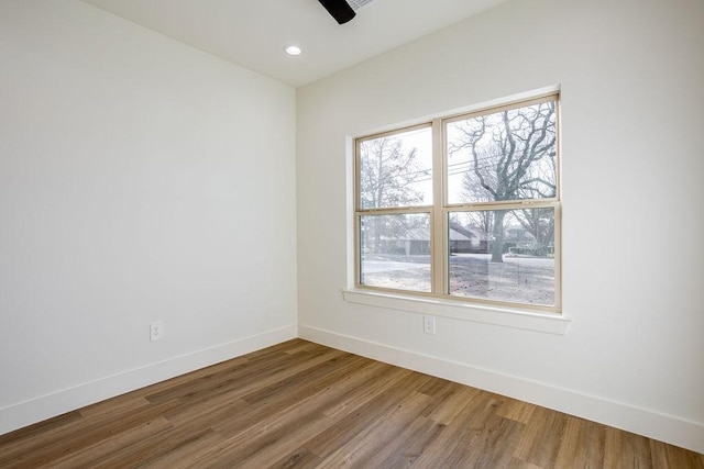 spare room featuring hardwood / wood-style flooring