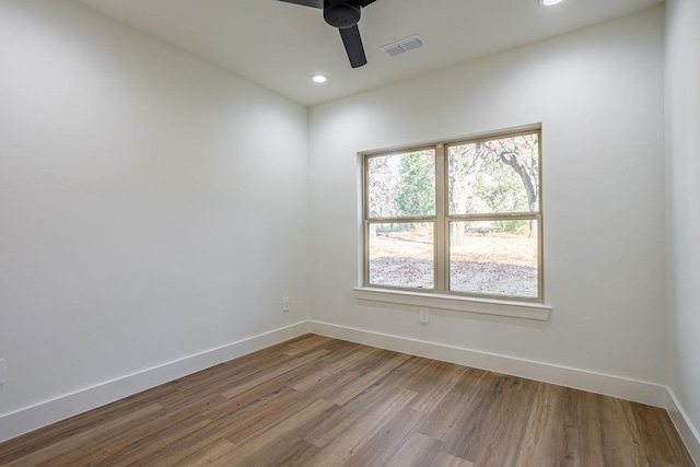 empty room featuring ceiling fan and wood-type flooring