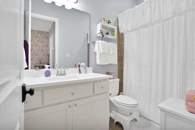 bathroom with vanity, toilet, and a shower with shower curtain