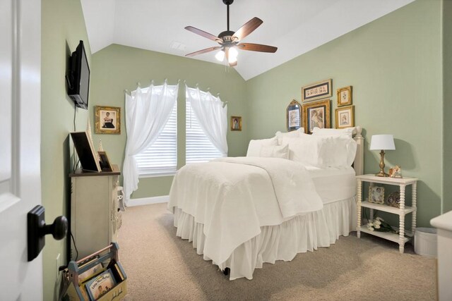 bedroom with carpet flooring, a ceiling fan, and lofted ceiling