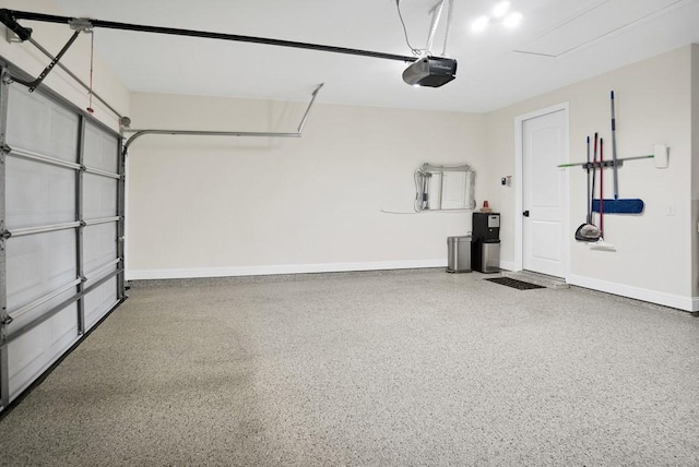 garage featuring baseboards and a garage door opener