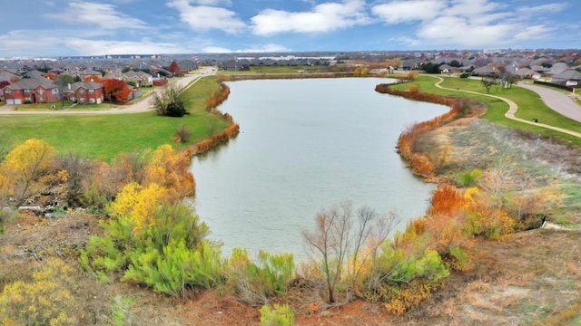 birds eye view of property featuring a residential view and a water view