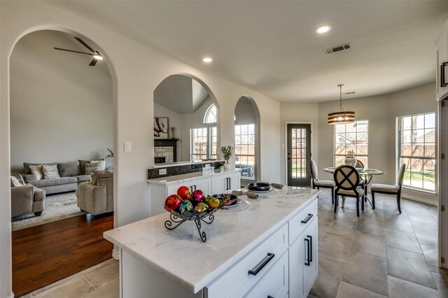 unfurnished living room featuring dark hardwood / wood-style flooring and high vaulted ceiling