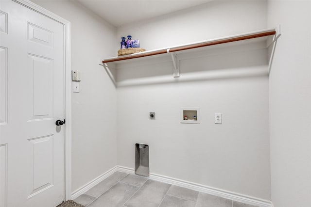 laundry room featuring hookup for an electric dryer, washer hookup, and light tile patterned floors