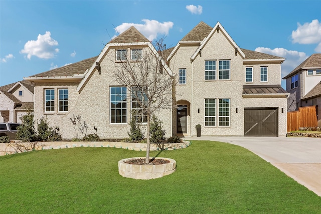 view of front facade with a front yard and a garage