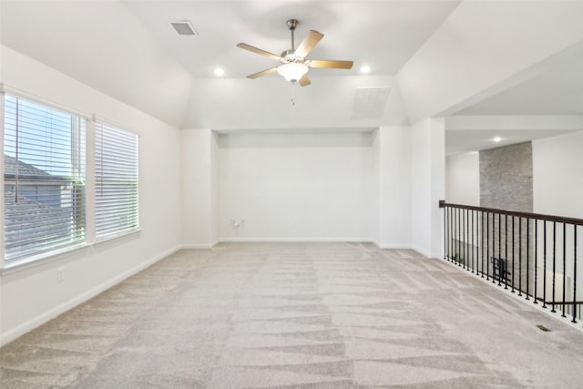 full bathroom with tile patterned flooring, tiled shower / bath, toilet, vanity, and lofted ceiling