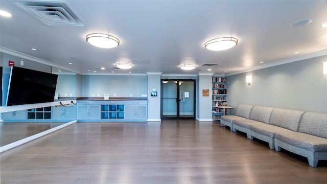 interior space with crown molding and wood-type flooring