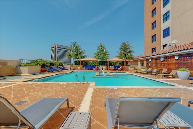 view of swimming pool featuring a gazebo and a patio area