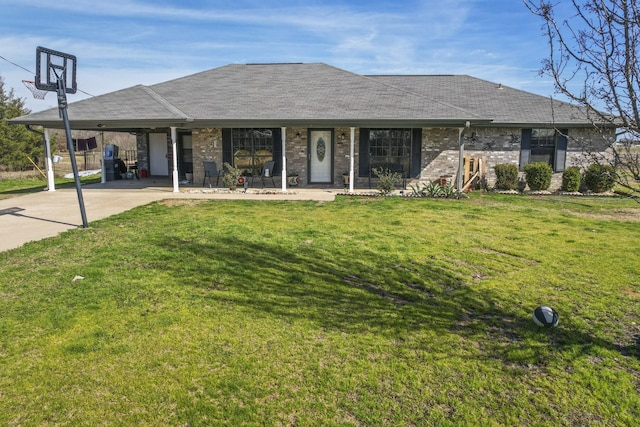 ranch-style home with a porch, a front yard, and a carport