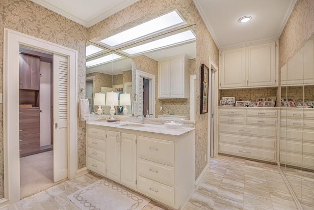 bathroom featuring vanity and ornamental molding