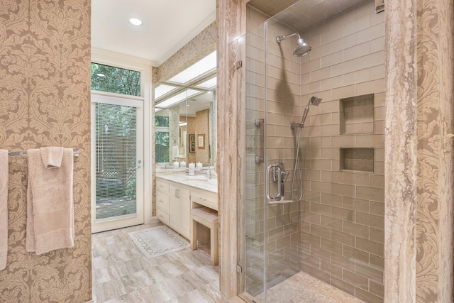 bathroom featuring vanity and a tile shower