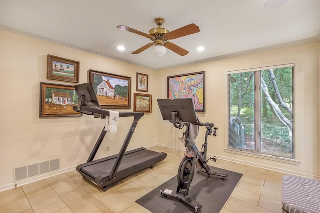 exercise room featuring ceiling fan, crown molding, and light tile patterned flooring