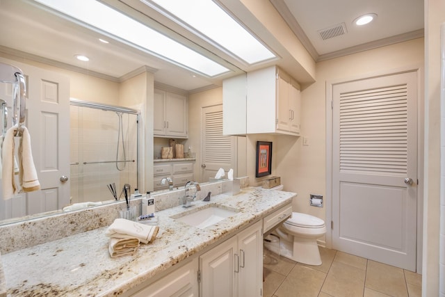 bathroom with an enclosed shower, a skylight, vanity, ornamental molding, and tile patterned flooring