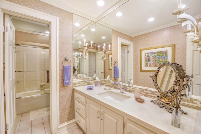 bathroom featuring tile patterned flooring, vanity, tiled shower / bath combo, and crown molding