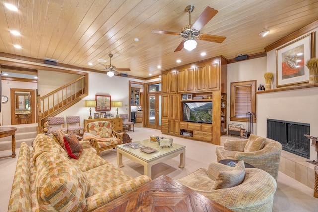 living room with a fireplace, light colored carpet, ceiling fan, and wooden ceiling