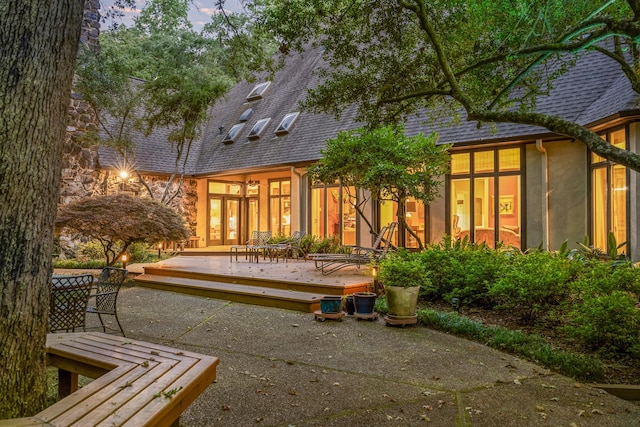 rear view of property with a patio area and a deck