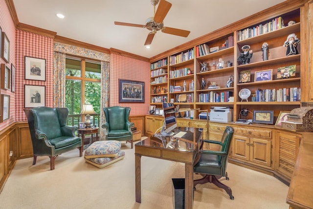 carpeted home office with ceiling fan and crown molding