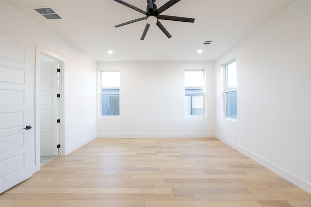 spare room featuring ceiling fan and light hardwood / wood-style floors