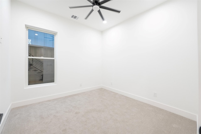 carpeted empty room with ceiling fan