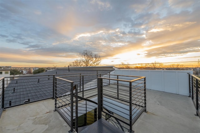 view of patio terrace at dusk