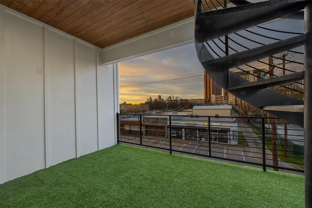 yard at dusk with a balcony