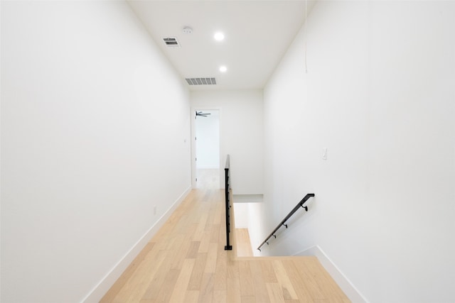 hall with hardwood / wood-style flooring