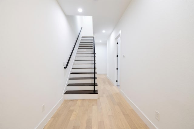 stairway featuring hardwood / wood-style floors