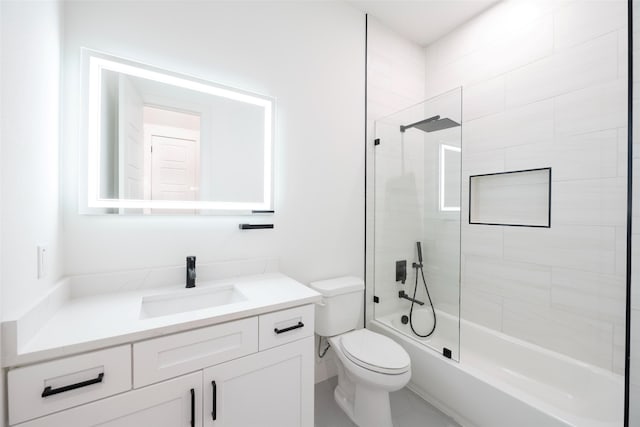 full bathroom with toilet, tiled shower / bath combo, and vanity