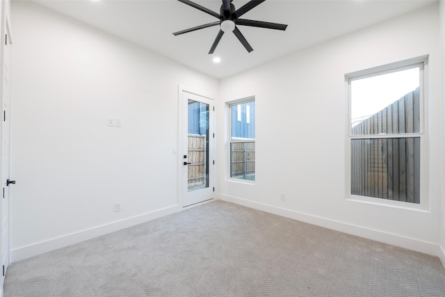 carpeted empty room with ceiling fan