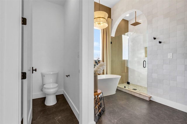 full bathroom with a stall shower, tile patterned floors, toilet, and baseboards