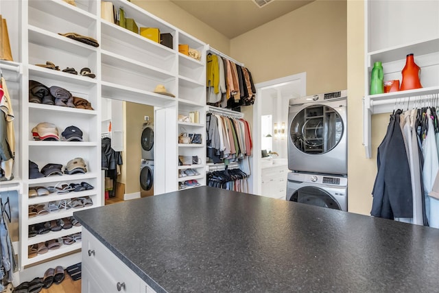 washroom with laundry area and stacked washing maching and dryer