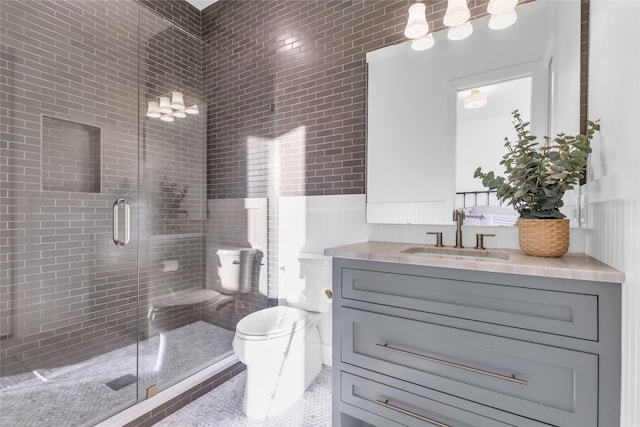 bathroom featuring an enclosed shower, vanity, and toilet