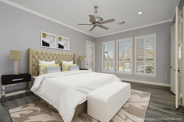 bedroom with dark hardwood / wood-style flooring, ceiling fan, and ornamental molding