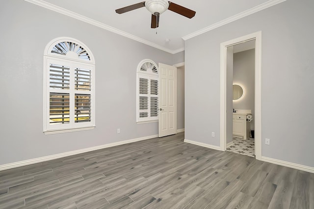 spare room featuring ceiling fan, ornamental molding, and hardwood / wood-style flooring