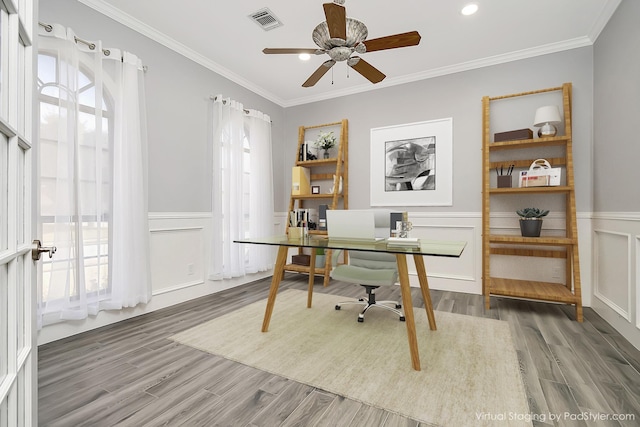 office featuring crown molding, ceiling fan, and dark wood-type flooring