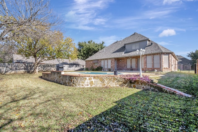 view of yard with a fenced in pool