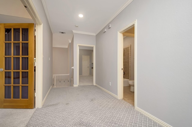 corridor with light carpet and crown molding