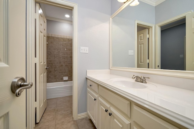 bathroom featuring tile patterned floors, vanity, tiled shower / bath combo, and ornamental molding