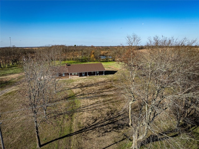 birds eye view of property with a rural view