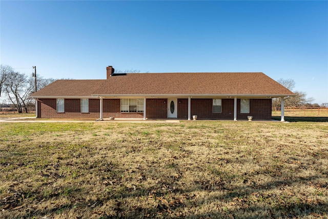 ranch-style home featuring a front yard