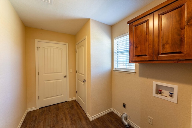 clothes washing area featuring dark hardwood / wood-style floors, cabinets, hookup for an electric dryer, and hookup for a washing machine