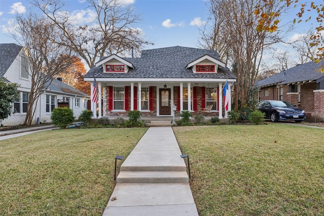 bungalow featuring a front yard and a porch